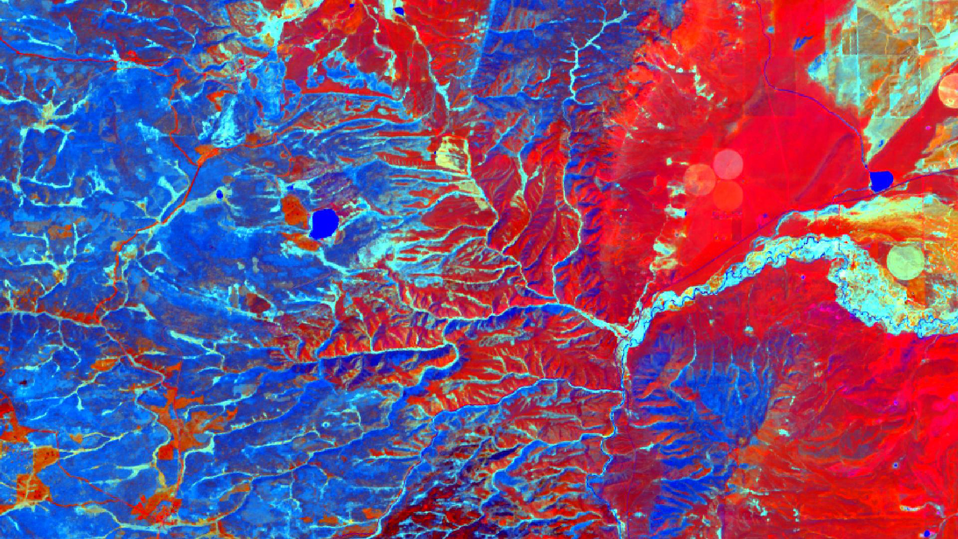 September 2nd, 2019 Multiband Tasseled cap Landsat 8 OLI image over Medicine Bow National Forest in Wyoming. Dark blue represents higher values of wetness, dark red represents higher values of combined green, red, and blue light reflectance and cyan represents higher values of greenness and wetness. Tasseled cap wetness was one of the most important predictor variables used in machine learning models to detect invasive cheatgrass (Bromus tectorum).Keywords: Spectral index, remote sensing