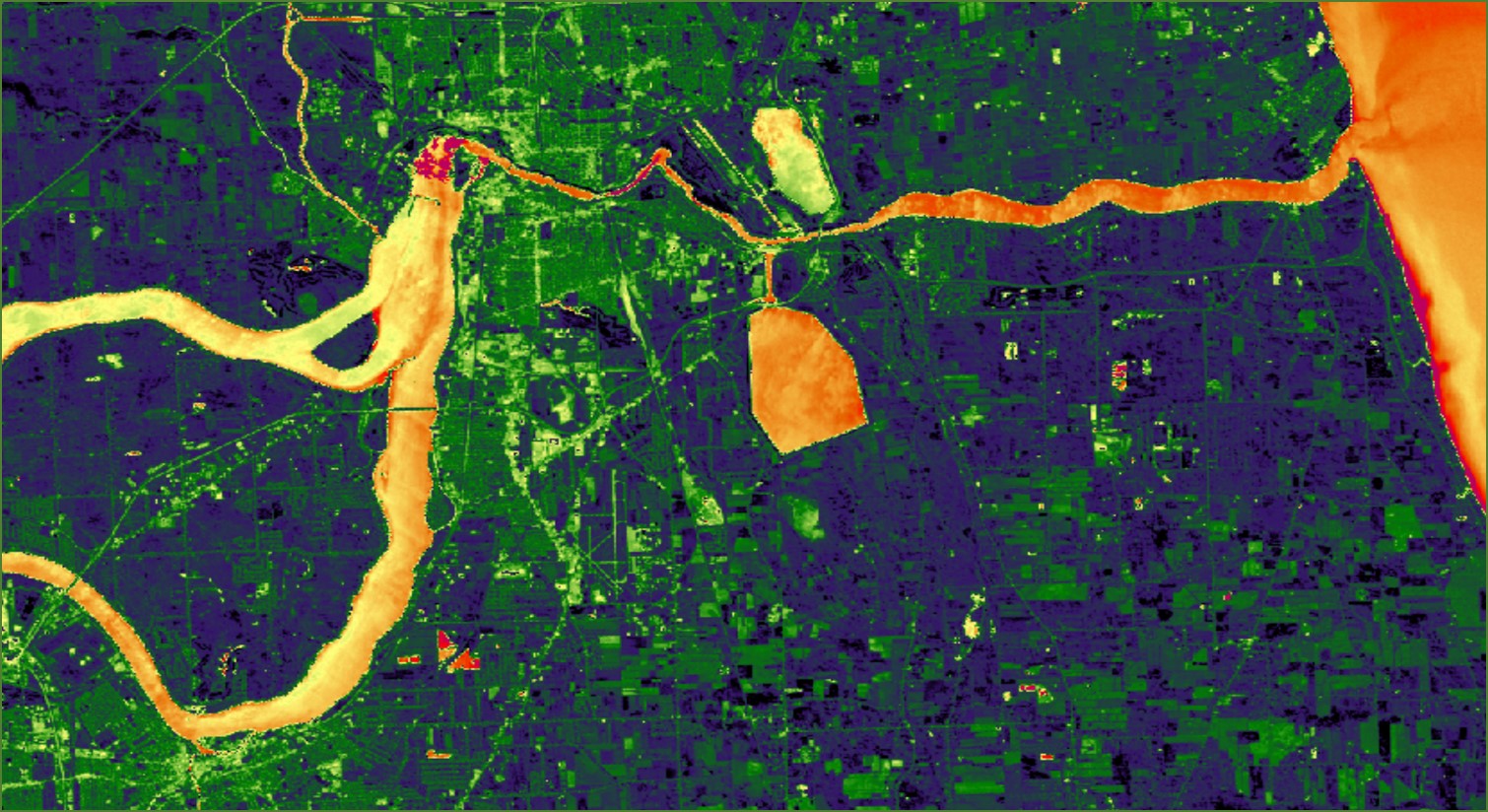 This is a processed image that shows the average of the Normalized Difference Water Index (NDWI) and the Modified NDWI (MNDWI) derived from June 1, 2017 Landsat 8 OLI data, with yellow and orange colors representing higher wetness relative to the dryer dark blue and green colors. The image shows the southern coast of Lake Ontario, centered on the city of Niagara Falls, New York, and indicates areas inundated by water.