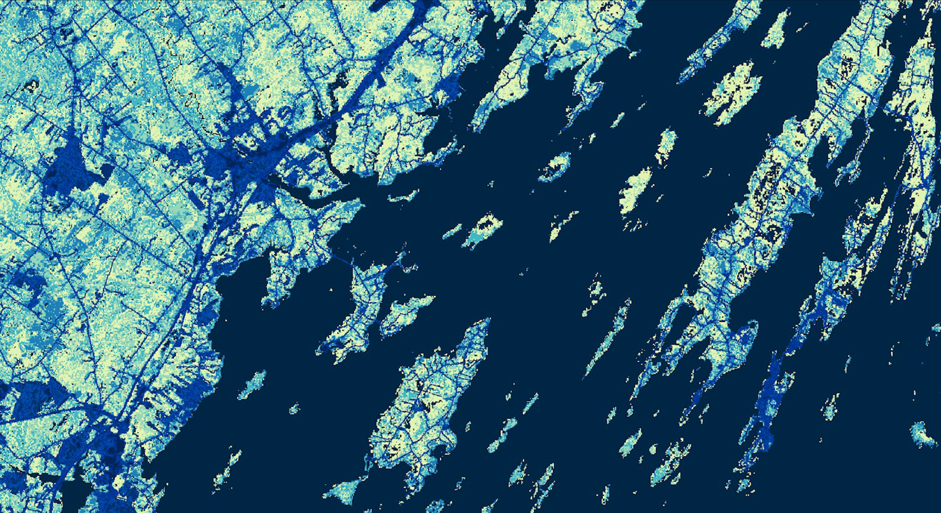 Above is a supervised land cover classification image using a mosaic of July 12, 19, and 28, 2018 Landsat 8 OLI data of Cumberland County, Maine. The shores of Yarmouth, Harpswell, and Chebeague Island are displayed. Scaled urbanization is shown with lighter blues indicating the most vegetated areas and darker blues indicating the most impervious urban areas. Navy blue represents water. Identifying the land cover type allows for better understanding of tick encounter risk.