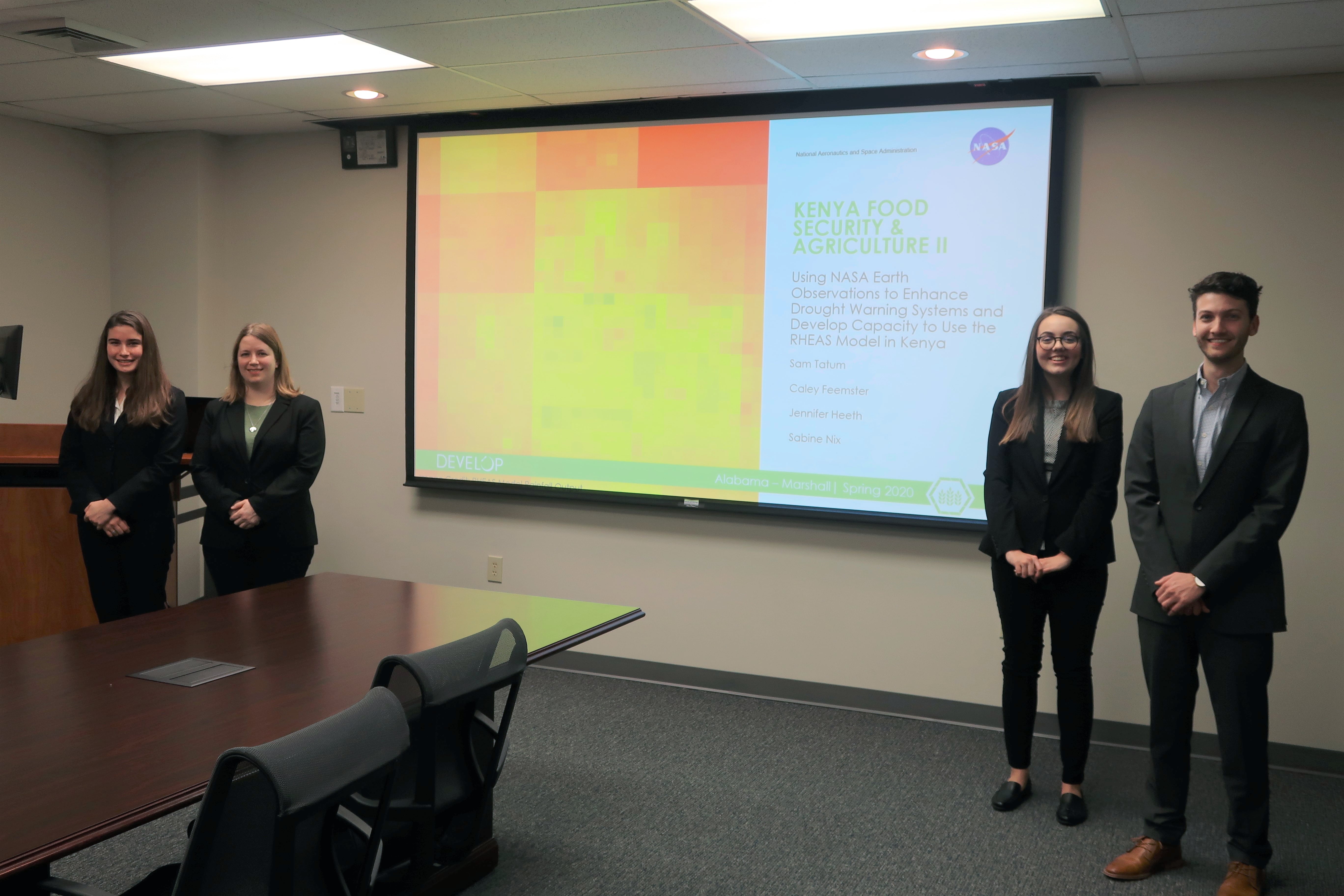 DEVELOP participants during an end-of-term presentation. Left to right: Sabine Nix, Jennifer Heeth, Caley Feemster, and Samuel Tatum. Image credit: Amiya Kalra