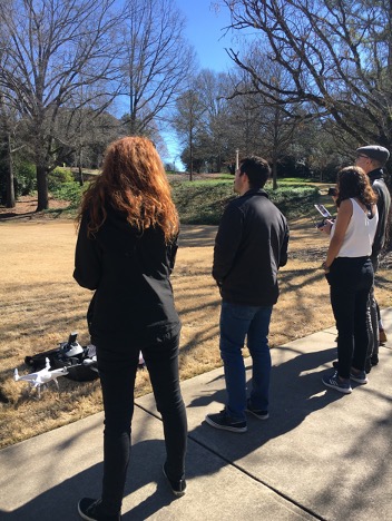 Spring 2020 participant, Kate Markham, and former Senior Fellow, Austin Stone, join a group of CGR researchers for a drone flying lesson by Science Advisor and CGR Associate Director Dr. Sergio Bernardes. Photo credit: Shelby Ingram