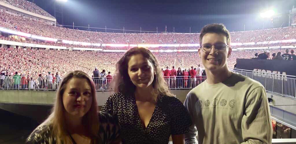 2019 fall DEVELOP participants (from left to right) Rochelle Williams, Kara Bissonnette, and Zachary Leslie attend a UGA football game at Sanford Stadium. Photo credit: Ryan Slapikas